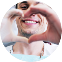 dentist making heart shape with hands