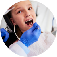 mon and child brushing teeth