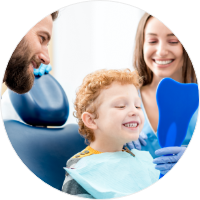 kid at dentist with parents